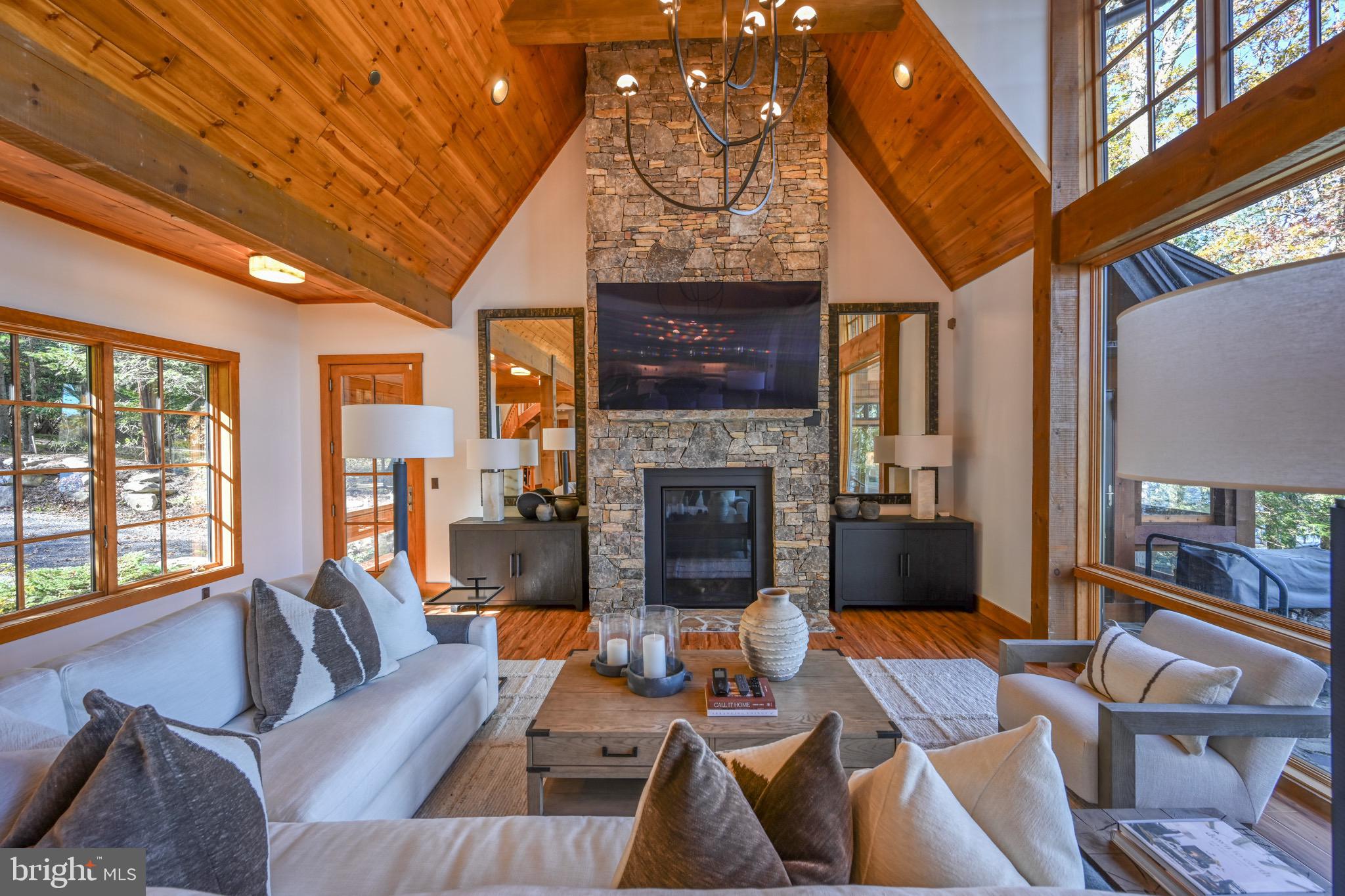 3135 Turkey Neck Road Swanton, MD 21561 - Photo 10 of 74 a living room with fireplace furniture and a large window