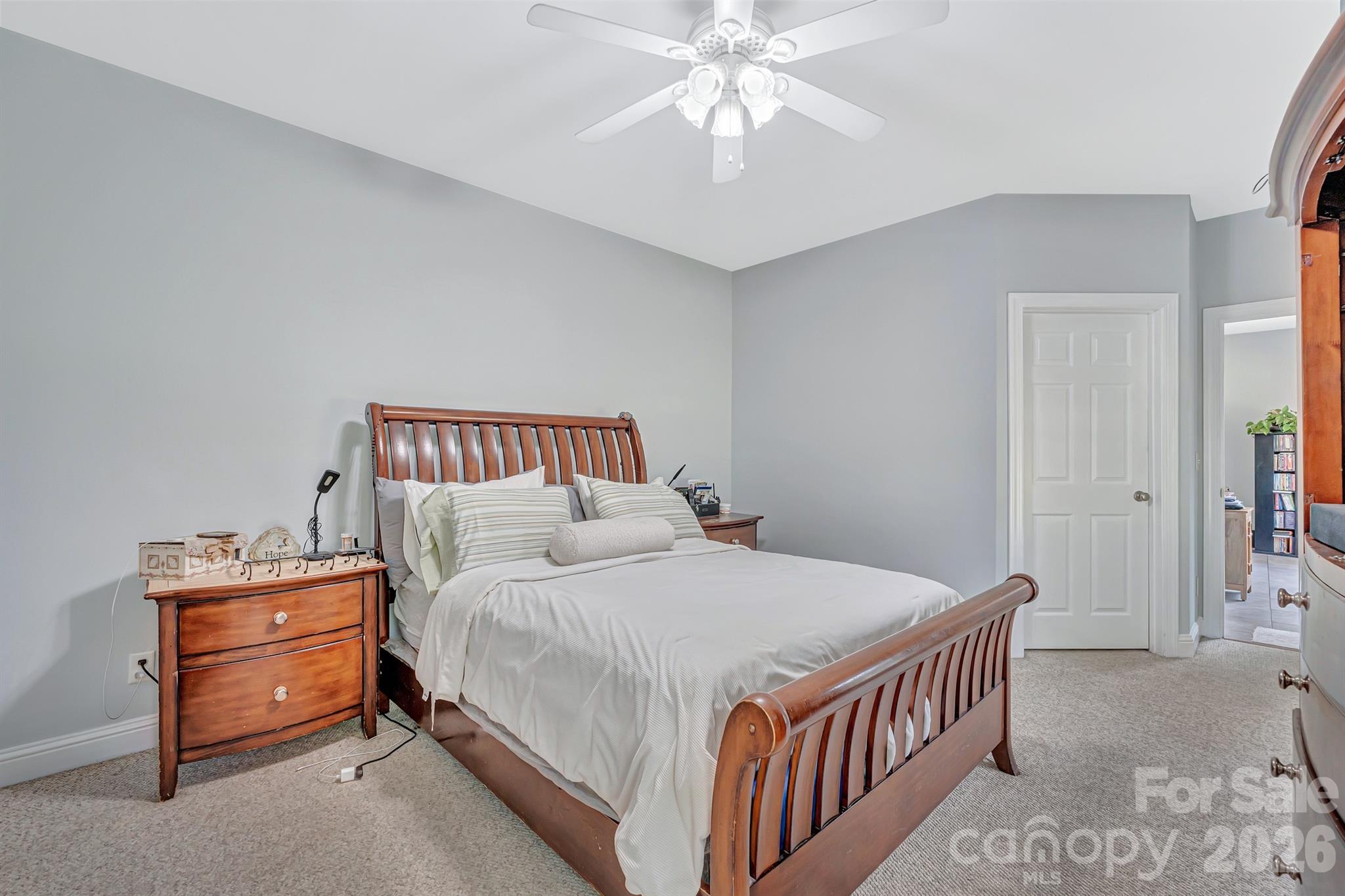 2538 Southside Road Lincolnton, NC 28092 - Photo 17 of 33 a bedroom with a bed and a chandelier