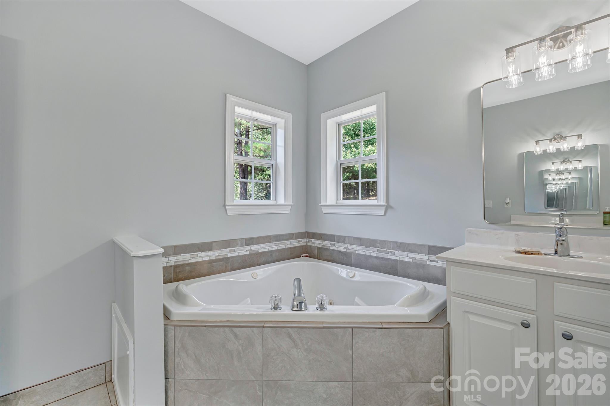 2538 Southside Road Lincolnton, NC 28092 - Photo 18 of 33 a bath tub sitting in a bathroom next to a window