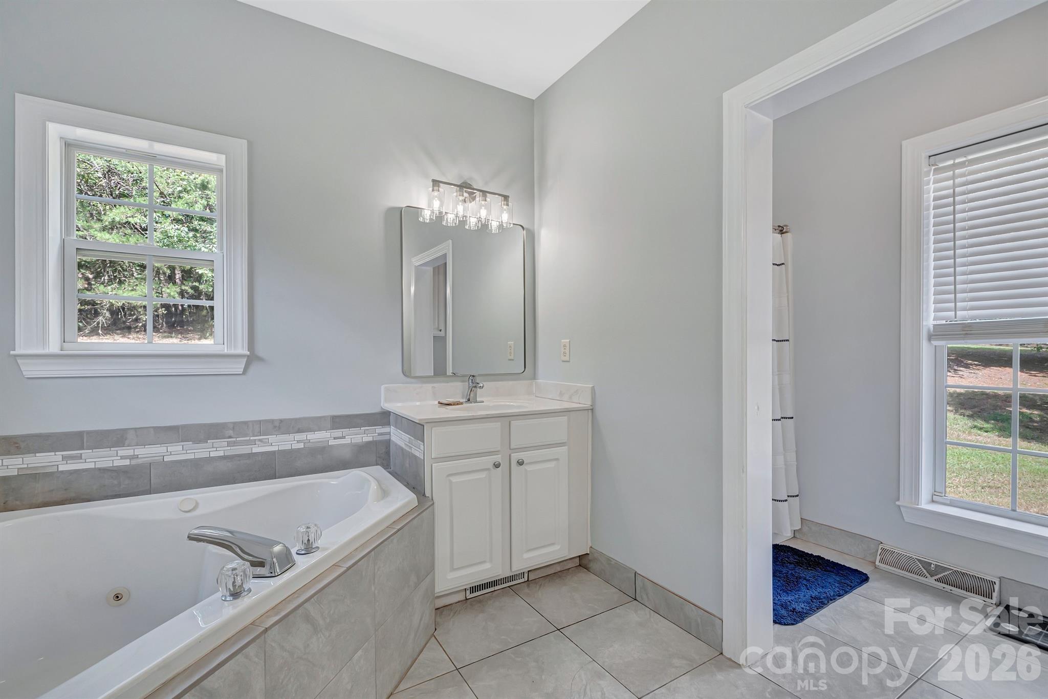 2538 Southside Road Lincolnton, NC 28092 - Photo 19 of 33 a spacious bathroom with a tub sink and mirror