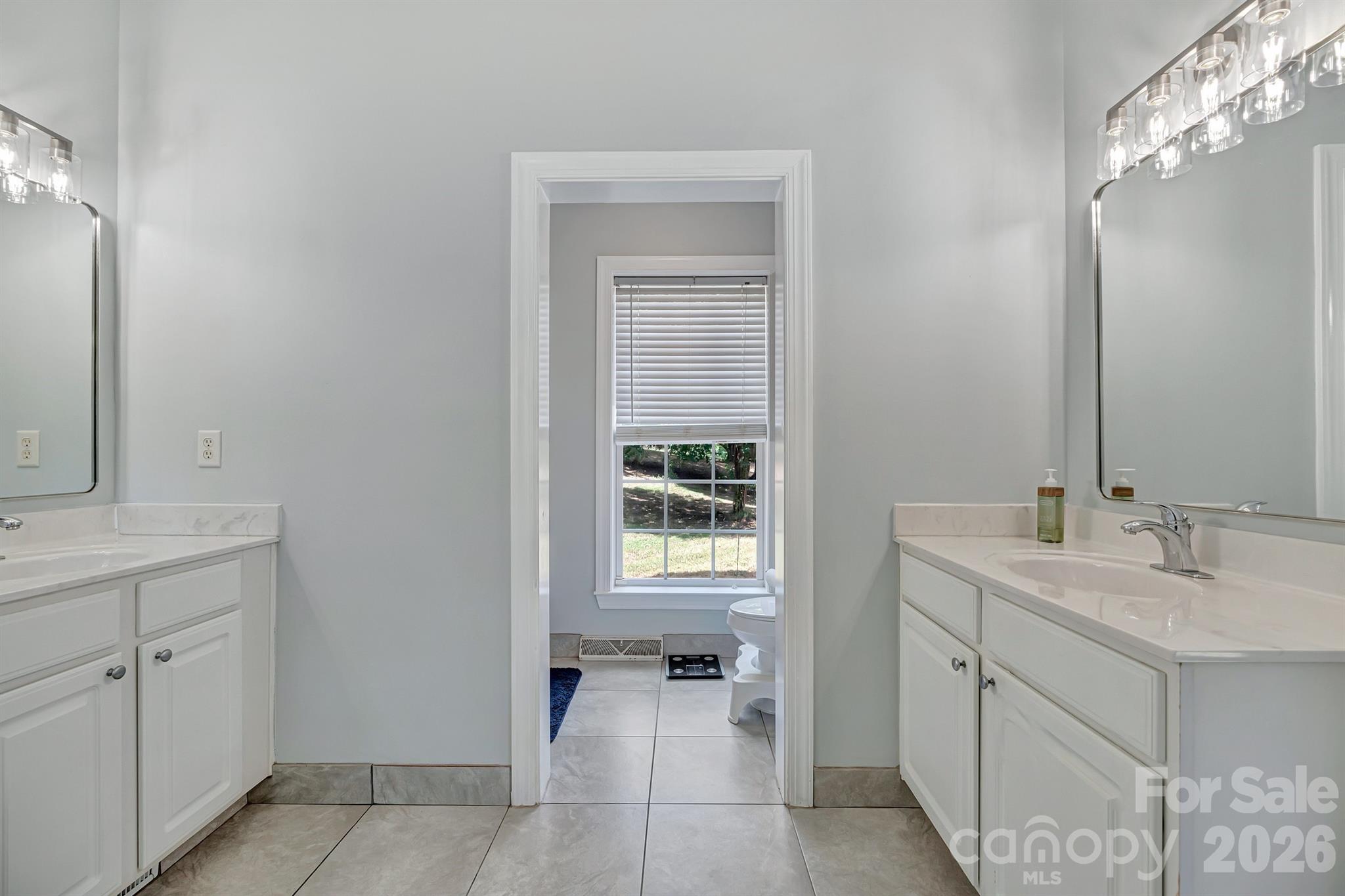 2538 Southside Road Lincolnton, NC 28092 - Photo 22 of 33 a spacious bathroom with a sink and a mirror