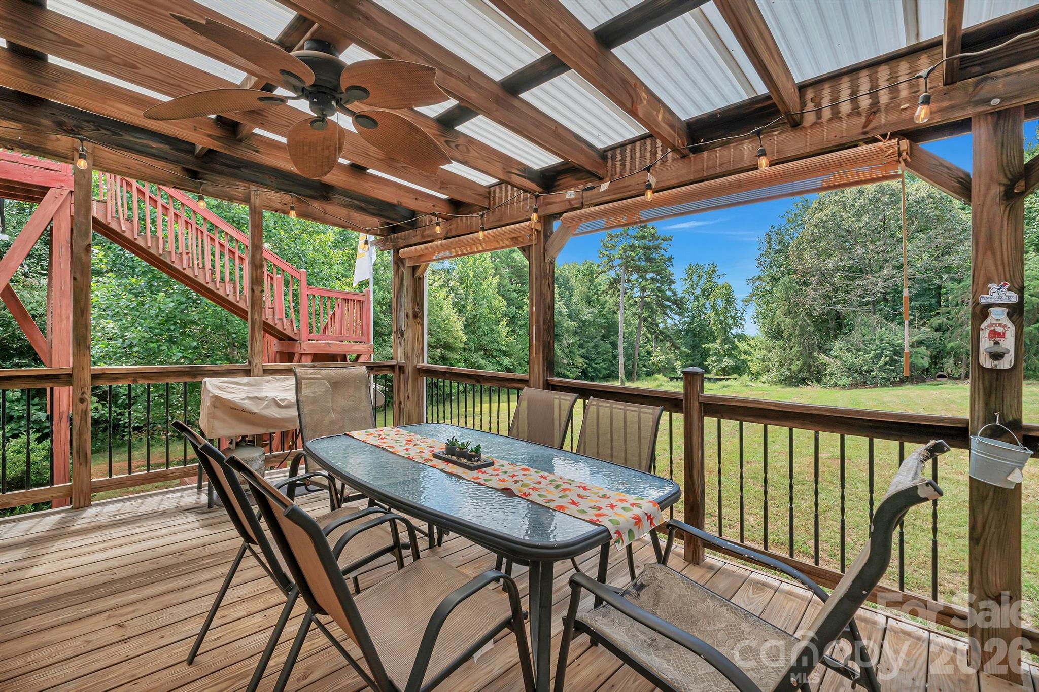 2538 Southside Road Lincolnton, NC 28092 - Photo 3 of 33 a view of a patio with a table chairs and a backyard