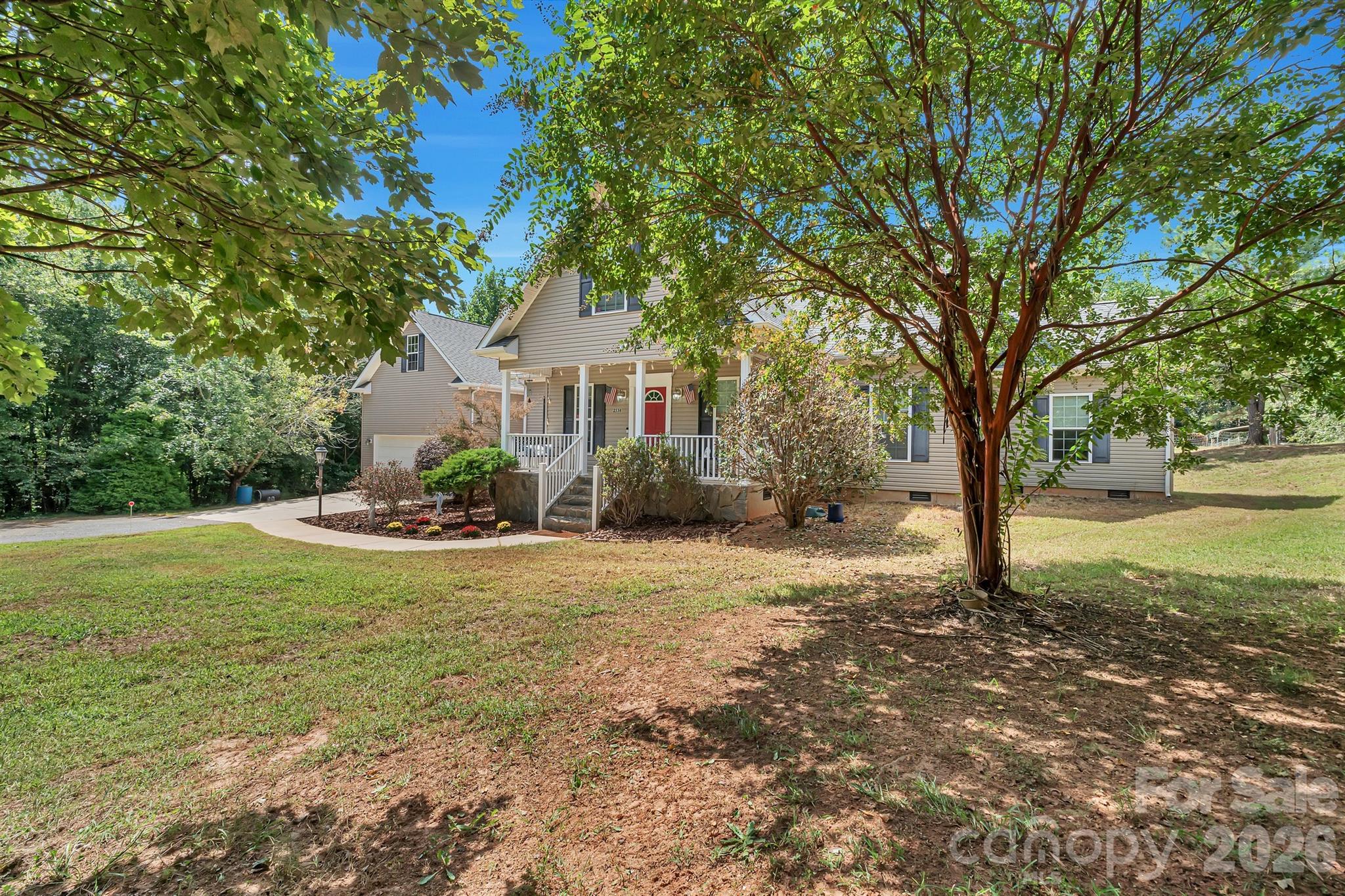 2538 Southside Road Lincolnton, NC 28092 - Photo 4 of 33 a house with trees in front of it