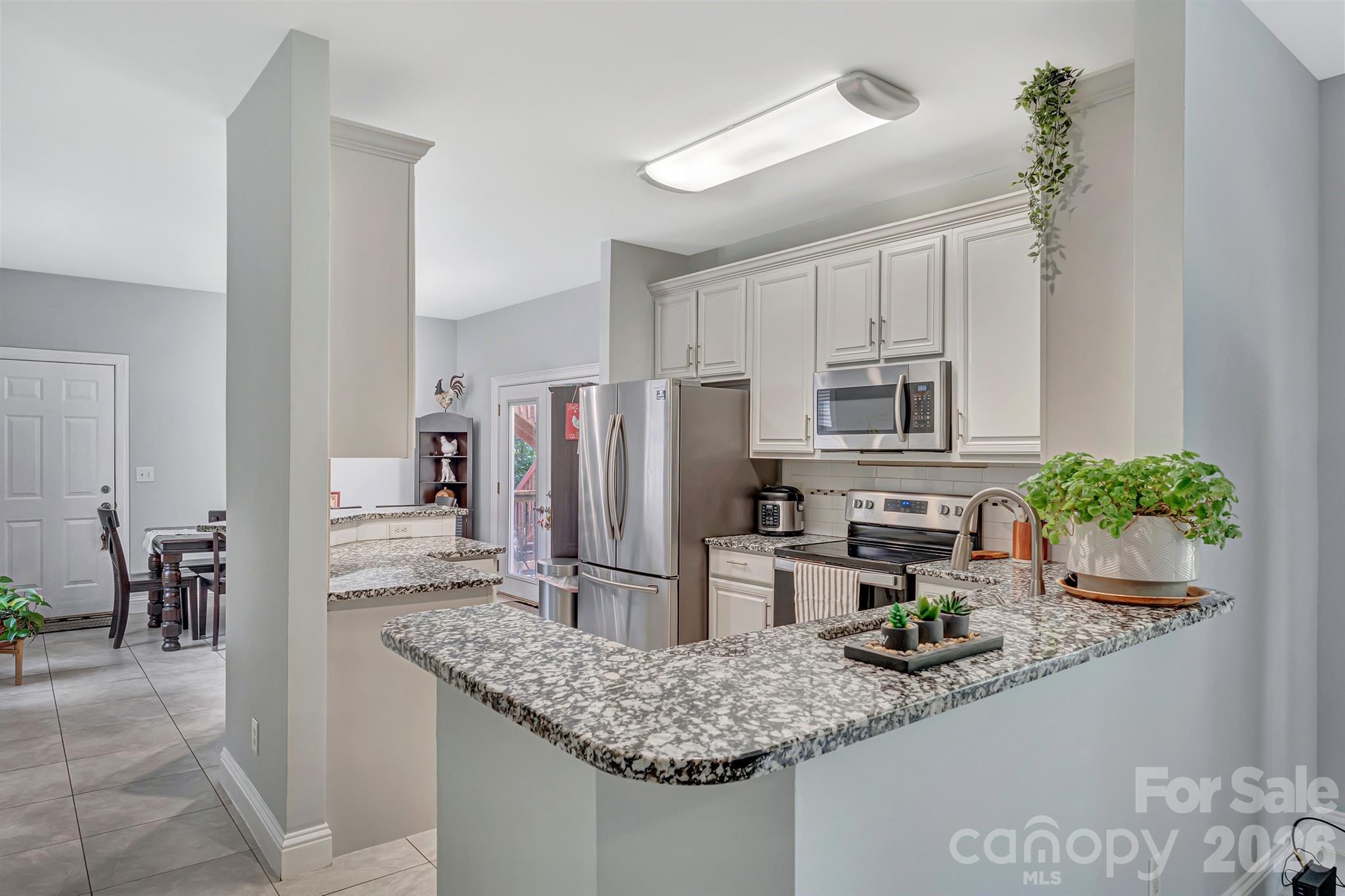 2538 Southside Road Lincolnton, NC 28092 - Photo 6 of 33 a kitchen with stainless steel appliances granite countertop a refrigerator a stove and a sink