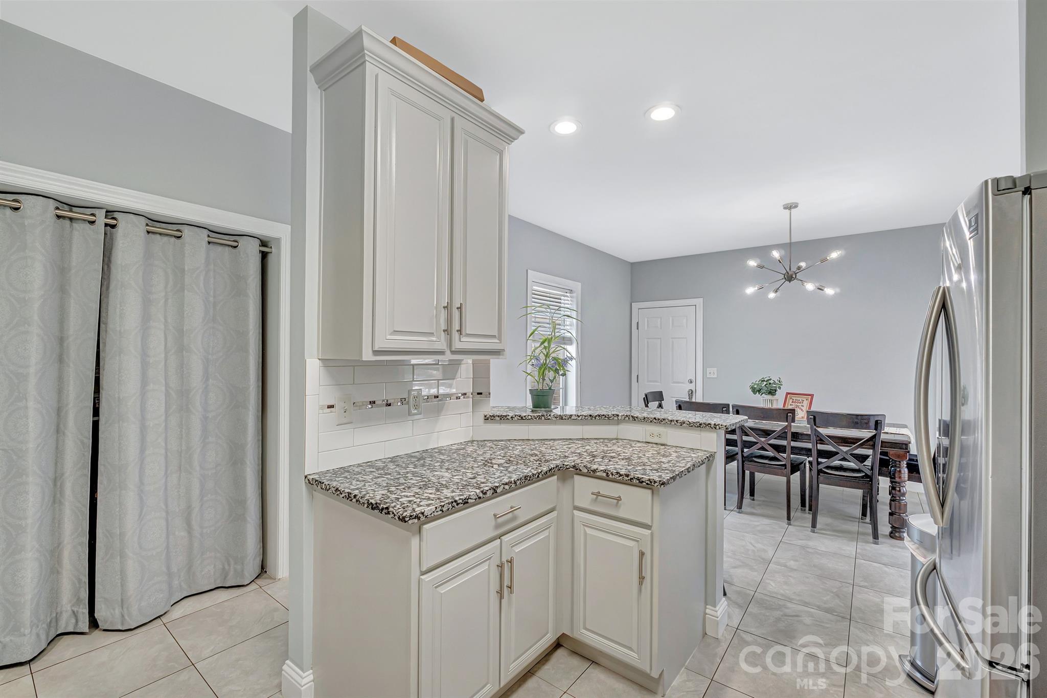 2538 Southside Road Lincolnton, NC 28092 - Photo 7 of 33 a kitchen with stainless steel appliances granite countertop a stove a sink and a refrigerator
