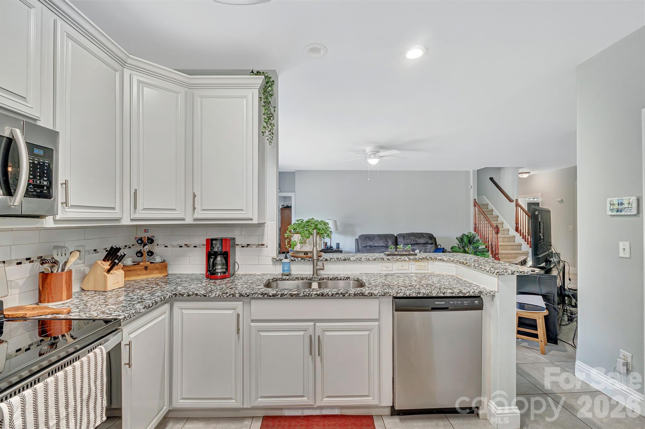 2538 Southside Road Lincolnton, NC 28092 - Photo 9 of 33 a kitchen with granite countertop a sink stainless steel appliances and cabinets