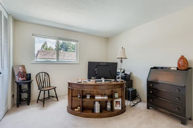 a room with furniture and gym equipment
