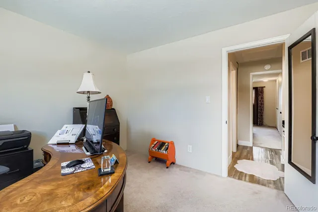 a room with furniture and a wooden floor