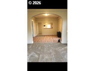 303 Donald Street Wallowa, OR 97885 - Photo 8 of 9 a view of a hallway with wooden floor