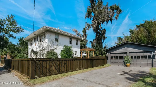 a front view of a house with yard
