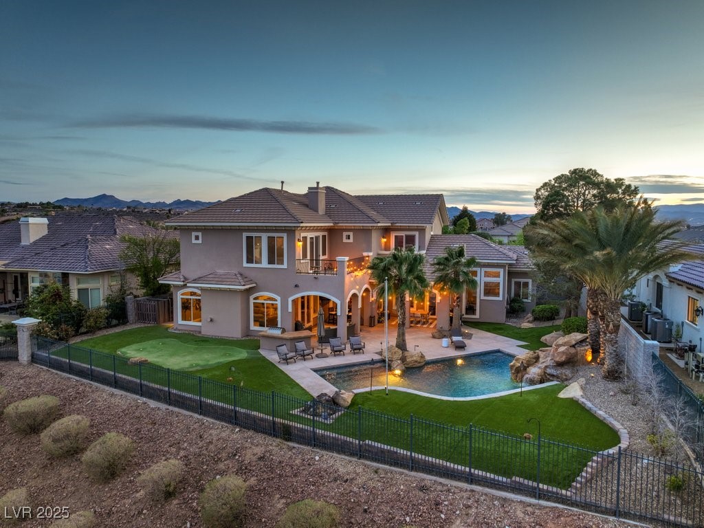 1377 Ruby Sky Court Henderson, NV 89052 - Photo 21 of 61 Back of property at dusk with a tile roof, stucco
