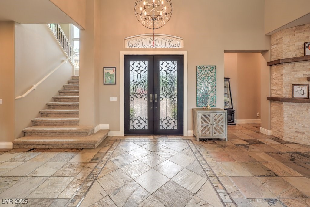 1377 Ruby Sky Court Henderson, NV 89052 - Photo 24 of 61 Beautiful Foyer with Double Iron Doors and Chandel