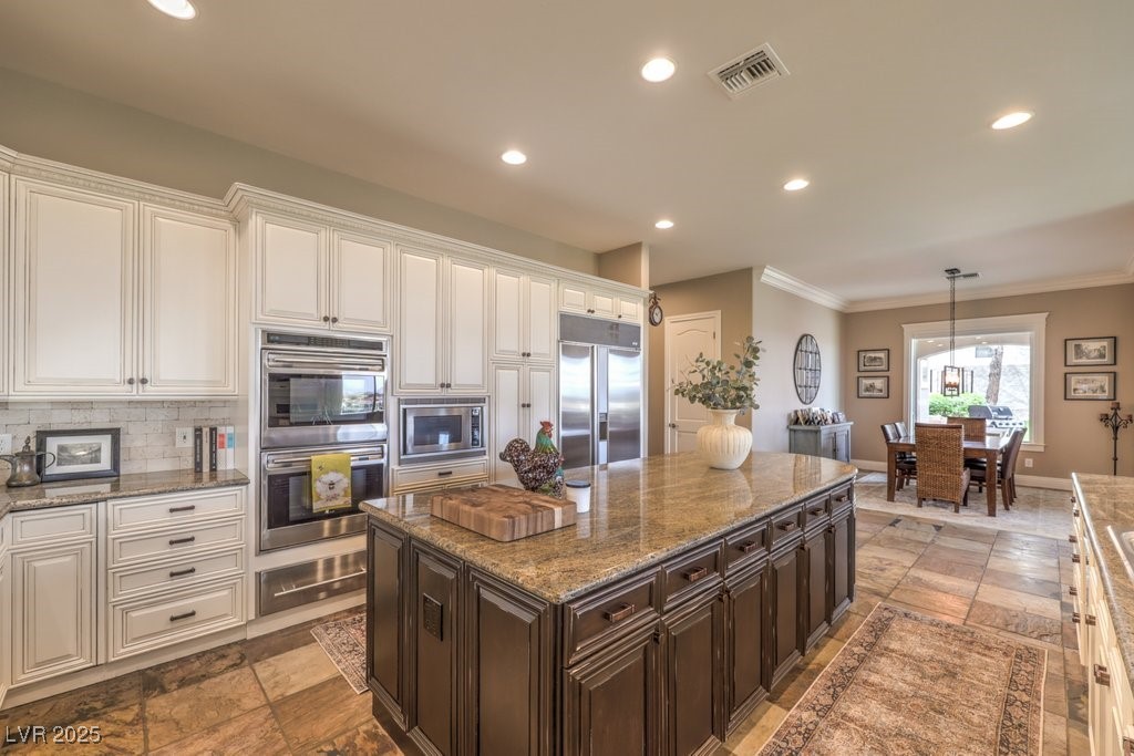 1377 Ruby Sky Court Henderson, NV 89052 - Photo 33 of 61 Huge Granite Island Slab and Double Ovens by Wolf