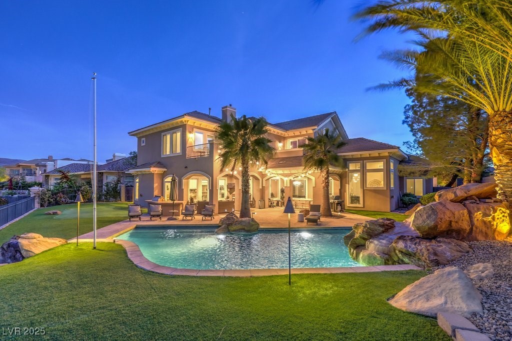 1377 Ruby Sky Court Henderson, NV 89052 - Photo 5 of 61 Outdoor pool with fence, a yard, and a patio area