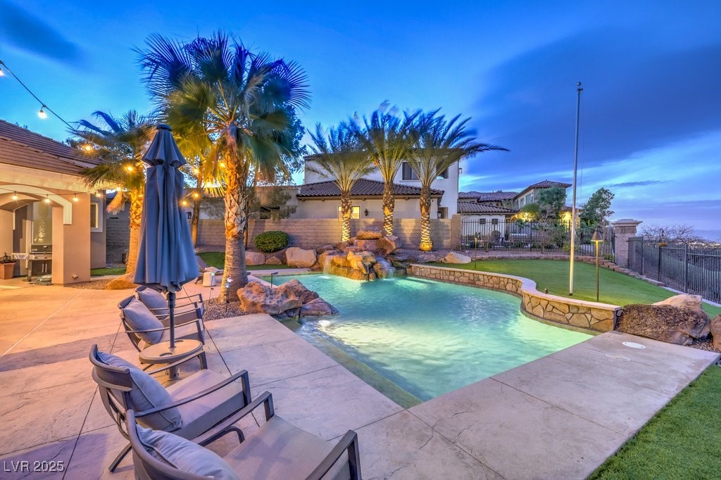 1377 Ruby Sky Court Henderson, NV 89052 - Photo 61 of 61 Pool at dusk with a fenced backyard, a fenced in p