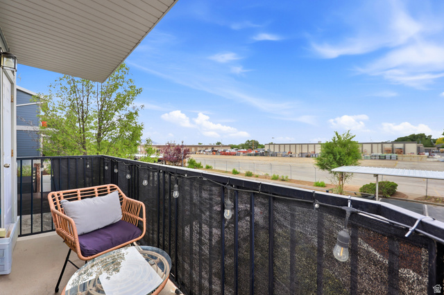116 East Resaca Drive, Unit F6 Sandy, UT 84070 - Photo 27 of 32 Outdoor balcony featuring a black metal railing and privacy screening