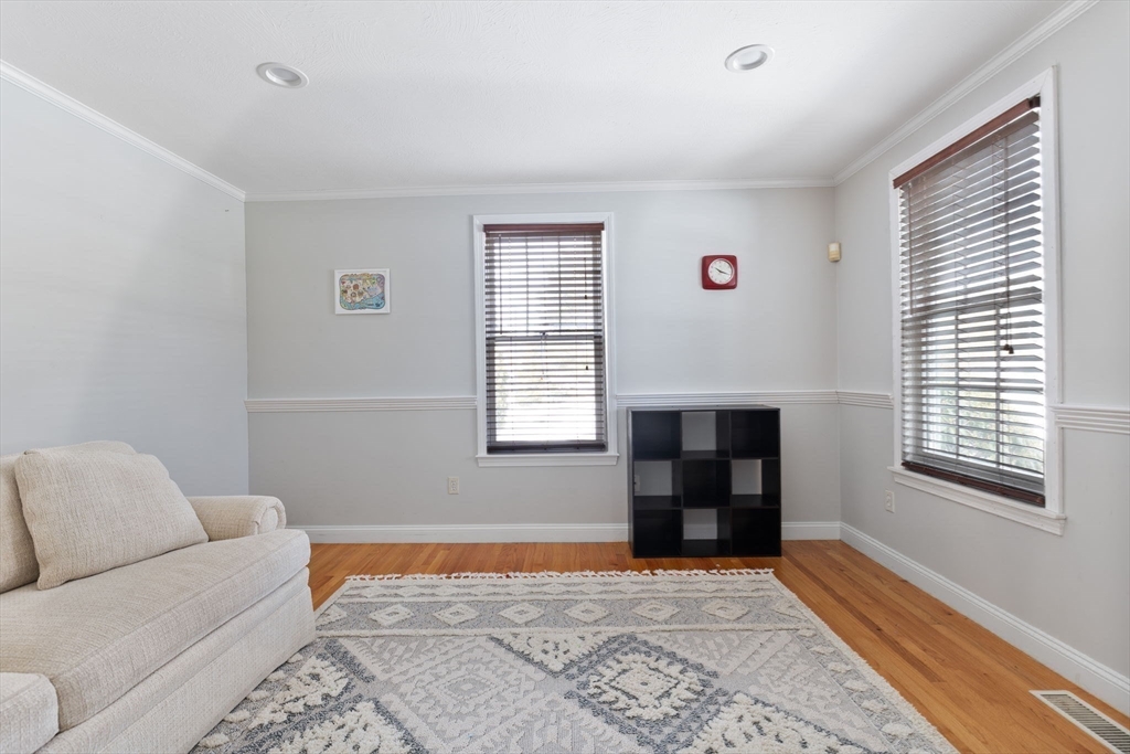 3 Independence Circle Beverly, MA 01915 - Photo 13 of 31 a living room with furniture and a window
