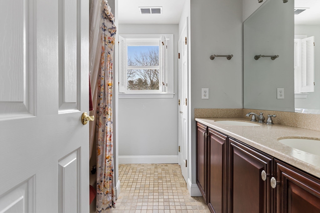 3 Independence Circle Beverly, MA 01915 - Photo 15 of 31 a bathroom with a sink and a mirror