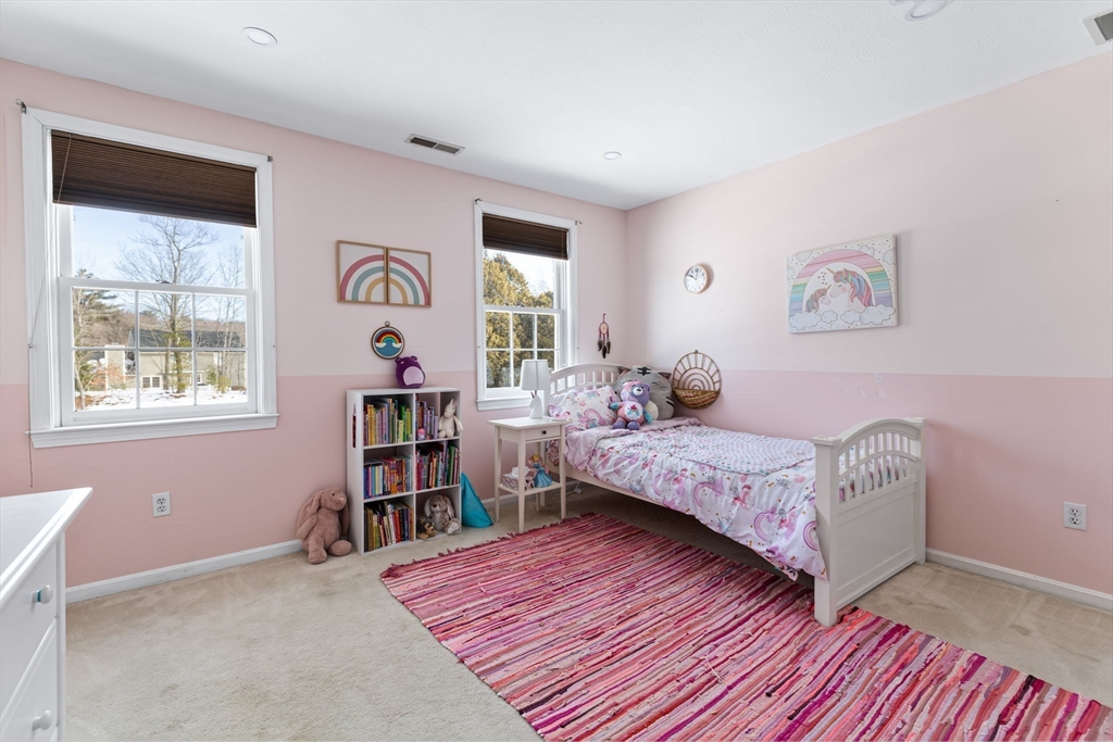 3 Independence Circle Beverly, MA 01915 - Photo 17 of 31 a bedroom with a bed and a book shelf