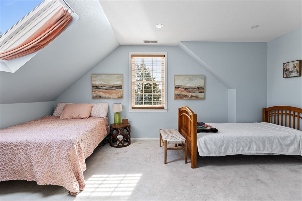 3 Independence Circle Beverly, MA 01915 - Photo 18 of 31 a bedroom with a bed chairs and a window