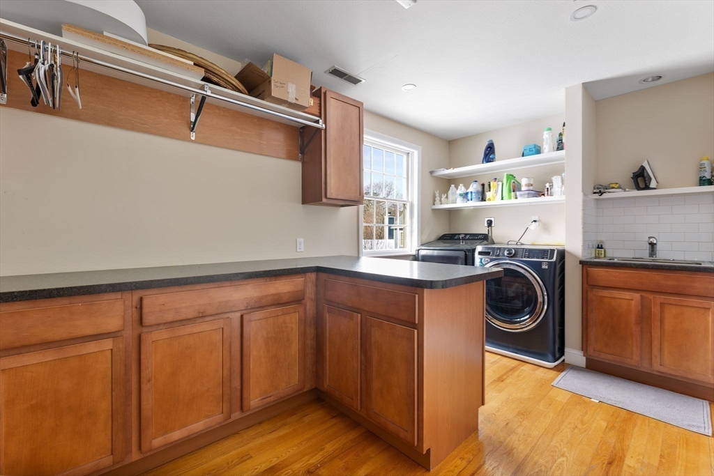3 Independence Circle Beverly, MA 01915 - Photo 19 of 31 a utility room with sink dryer and washer