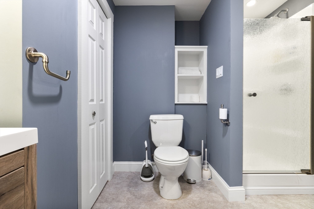 3 Independence Circle Beverly, MA 01915 - Photo 26 of 31 a white toilet sitting next to a bathroom sink