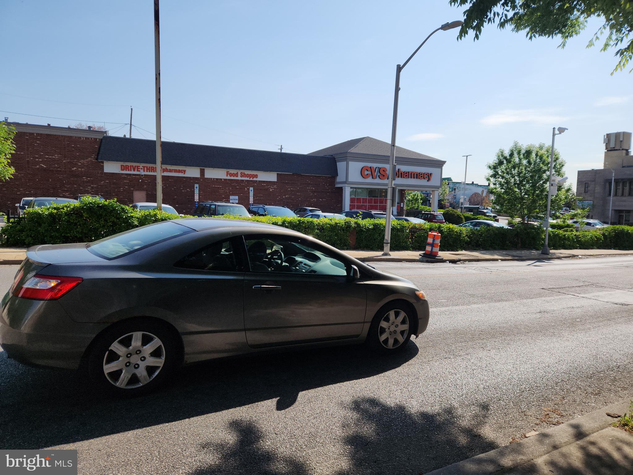 3017 Erdman Avenue Baltimore, MD 21213 - Photo 12 of 13 a car parked in front of a house