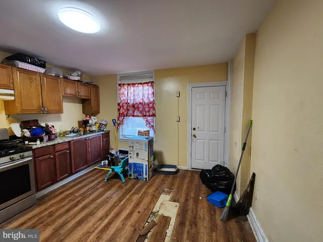 a room with furniture a rug and a window