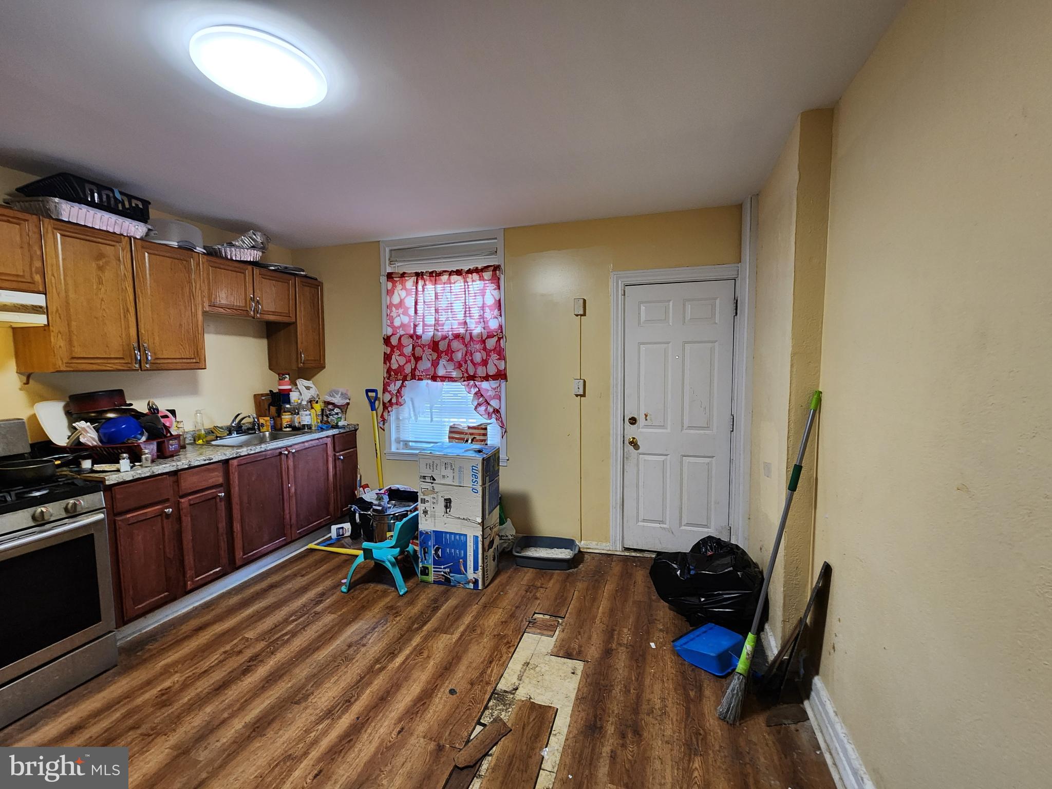 3017 Erdman Avenue Baltimore, MD 21213 - Photo 6 of 13 a room with furniture a rug and a window
