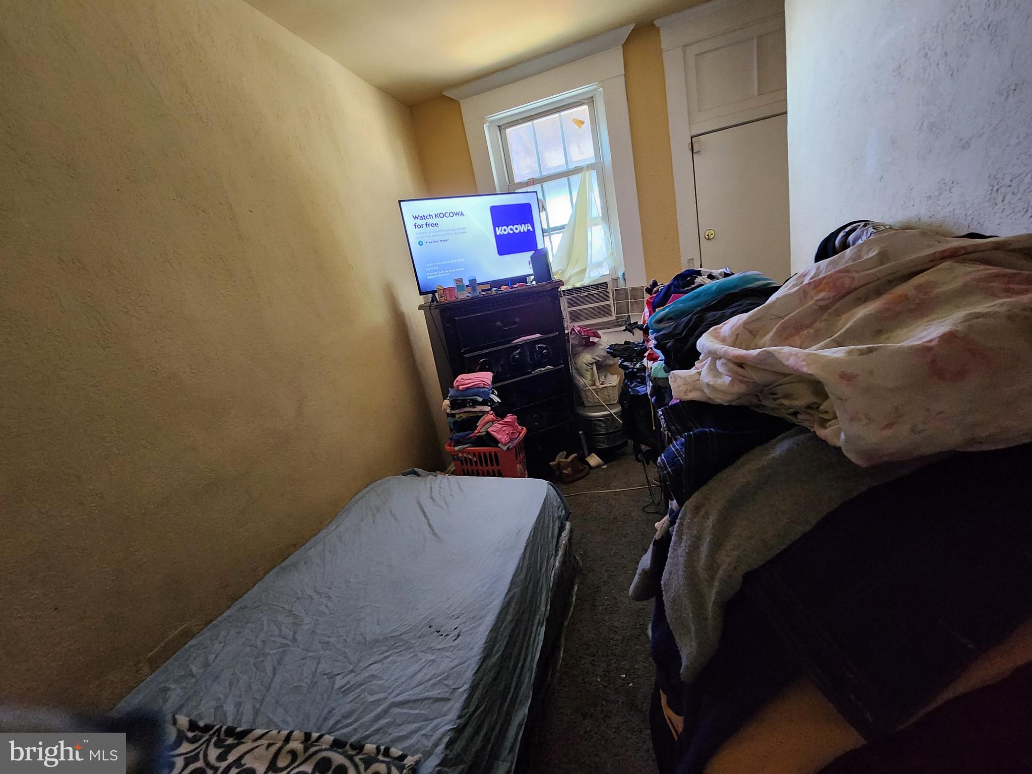 3017 Erdman Avenue Baltimore, MD 21213 - Photo 8 of 13 a living room with furniture and a window