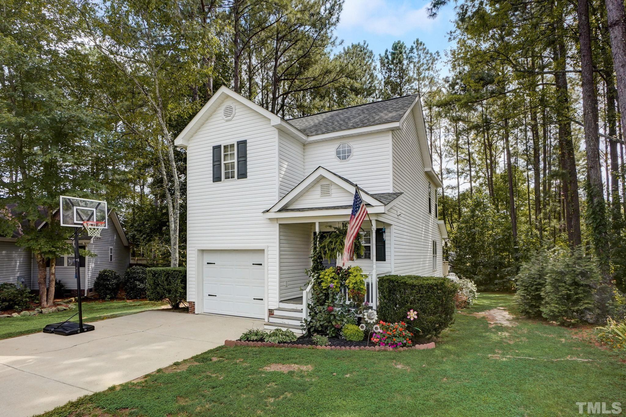 1002 Tawana Court Knightdale, NC 27545 - Photo 1 of 30 a front view of a house with a yard and garage