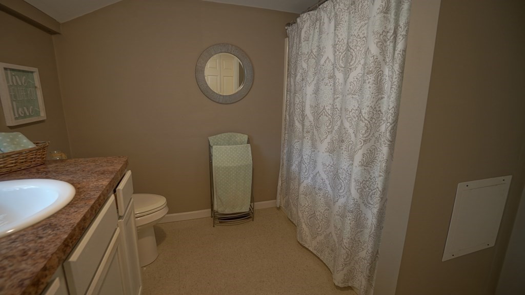 245 Fair Oak Road Springfield, MA 01128 - Photo 18 of 37 a bathroom with a granite countertop sink and a mirror