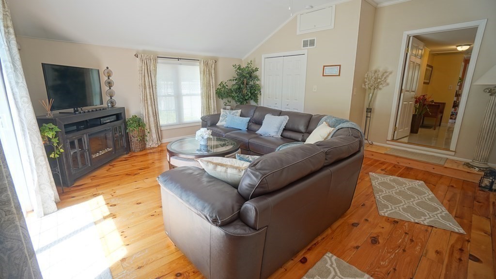245 Fair Oak Road Springfield, MA 01128 - Photo 20 of 37 a living room with furniture and a flat screen tv