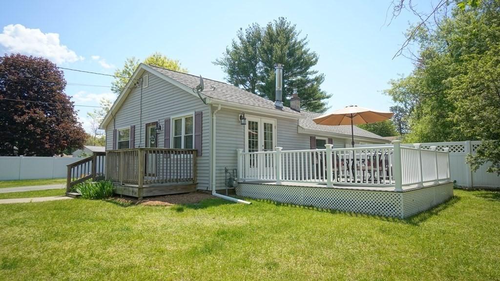 245 Fair Oak Road Springfield, MA 01128 - Photo 2 of 37 a view of a house with a yard and deck