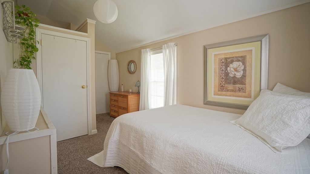 245 Fair Oak Road Springfield, MA 01128 - Photo 23 of 37 a bedroom with a bed and a window