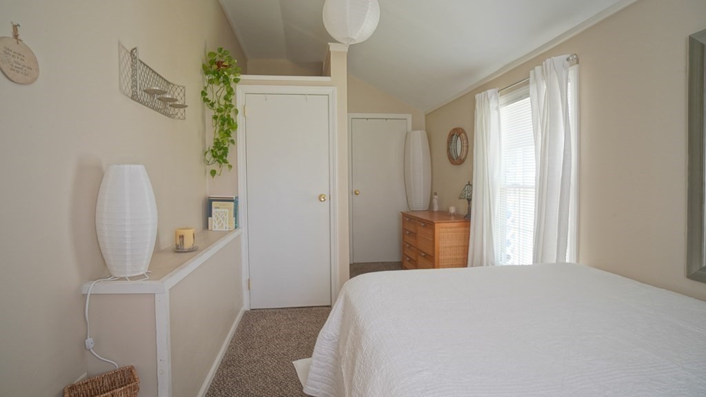 245 Fair Oak Road Springfield, MA 01128 - Photo 24 of 37 a bedroom with a bed and a mirror
