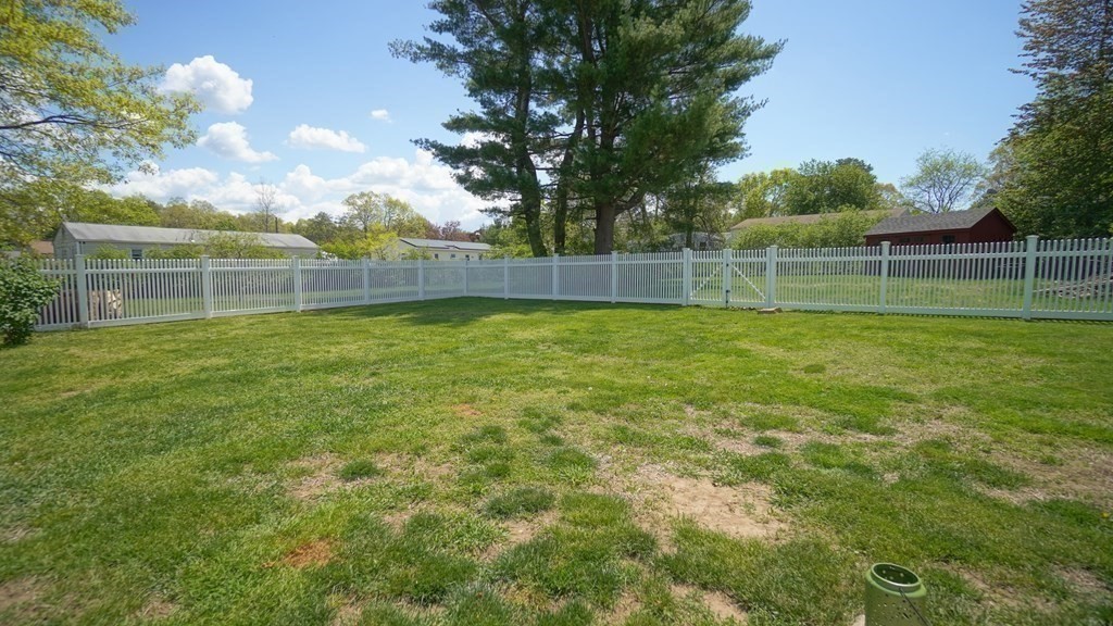 245 Fair Oak Road Springfield, MA 01128 - Photo 26 of 37 a backyard of a house with lots of green space