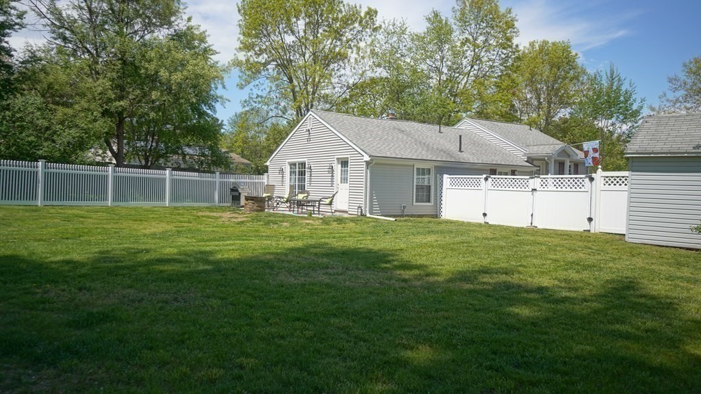 245 Fair Oak Road Springfield, MA 01128 - Photo 28 of 37 a house that is sitting in the grass
