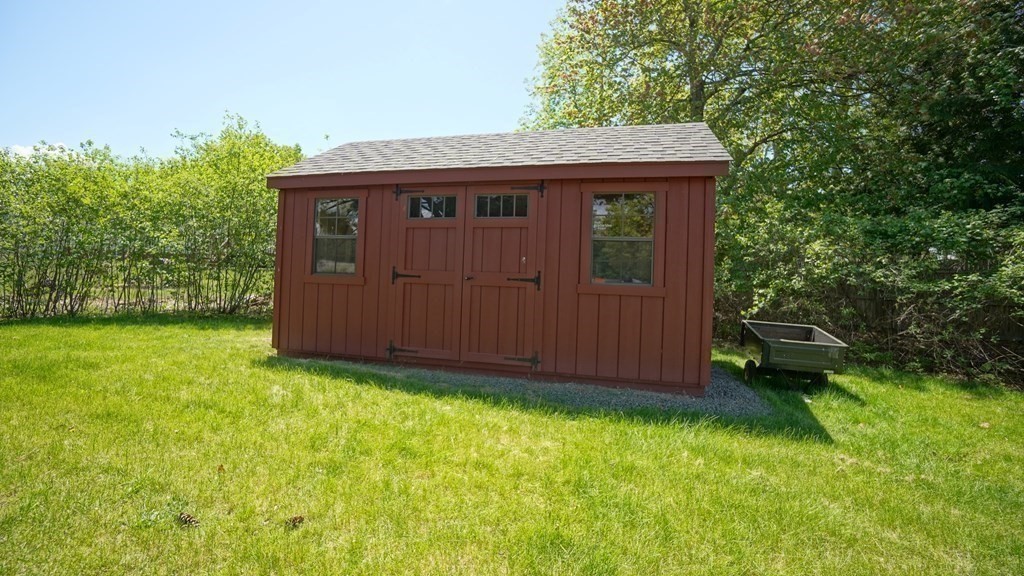 245 Fair Oak Road Springfield, MA 01128 - Photo 30 of 37 a view of a barn in the middle of a yard