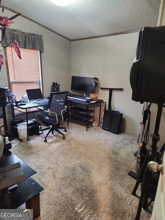 a bedroom with a bed and a desk