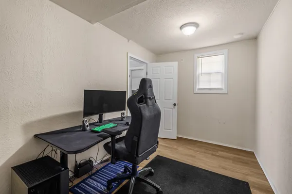 a view of a workspace with furniture