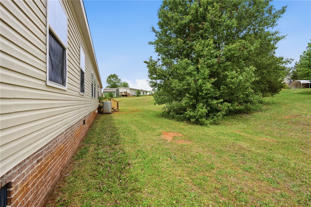 112 Sir Francis Drake Way Liberty, SC 29657 - Photo 9 of 42 This spacious yard offers a verdant canvas for outdoor living and relaxation.