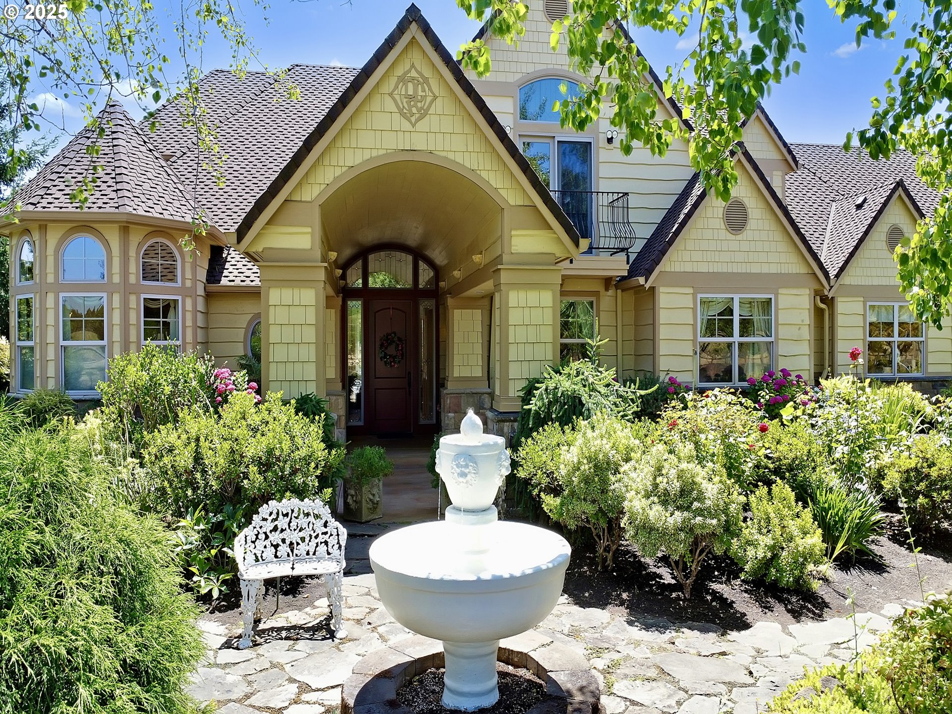 a front view of a house with garden