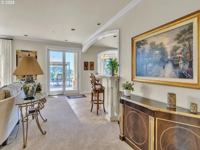a living room with furniture a window and a flat screen tv