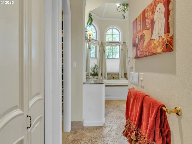 a view of a bathroom with a tub and a window