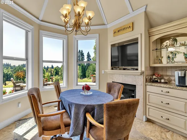 a view of a dining room with furniture window and outside view