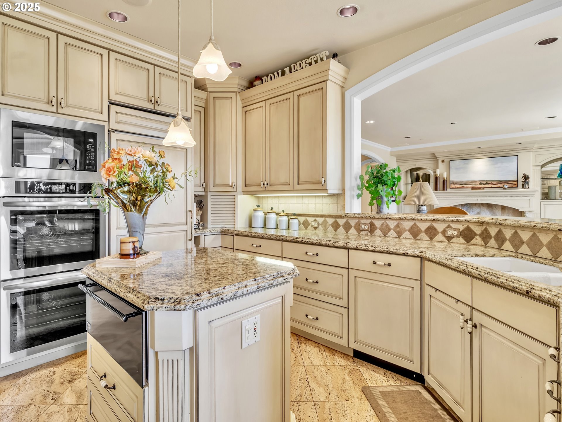 13424 Ehlen Road Northeast Aurora, OR 97002 - Photo 22 of 48 a kitchen with stainless steel appliances granite countertop a sink stove and refrigerator