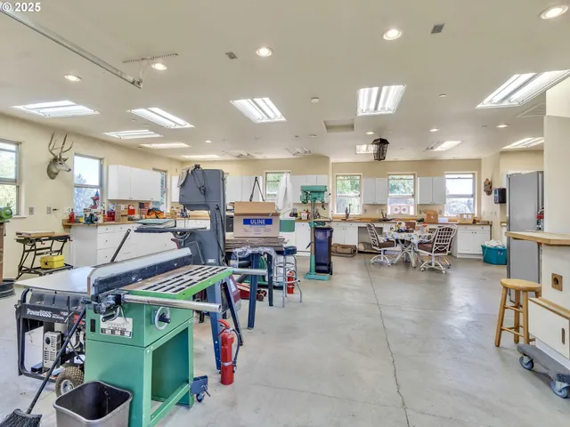 a living room with lots of furniture and clutter