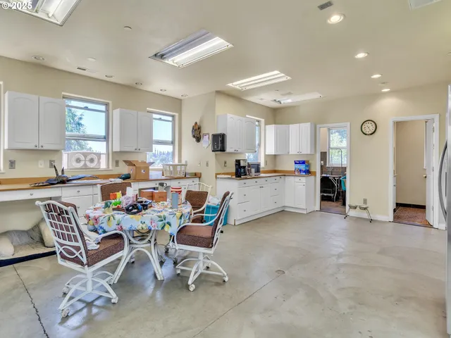 a living room with furniture and kitchen view