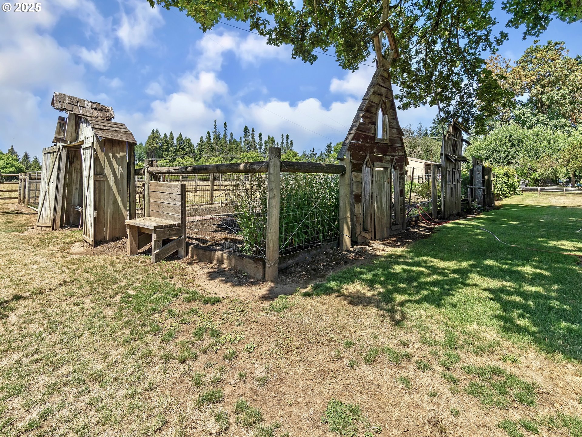 13424 Ehlen Road Northeast Aurora, OR 97002 - Photo 38 of 48 a view of a chair and tables in the patio next to a yard